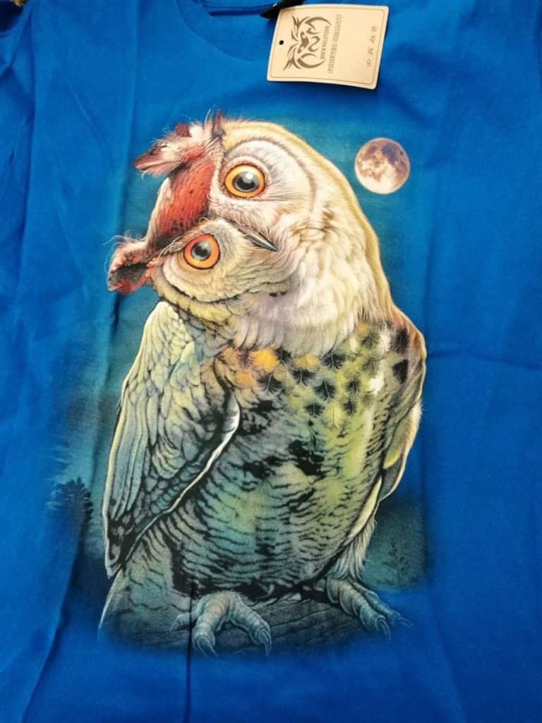 Bedruckte T-Shirts mit Tiermotiv für Damen und Herren - Eule gedrehter Kopf blau - gründlich sparen - einkaufen in bad grund 
